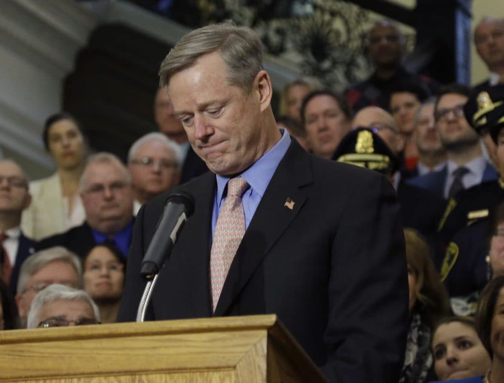 Mass. Gov. Charlie Baker becomes emotional as he speaks after signing sweeping legislation aimed at reversing a deadly opioid addiction crisis, during a signing ceremony at the Statehouse Monday. (Elise Amendola/AP)