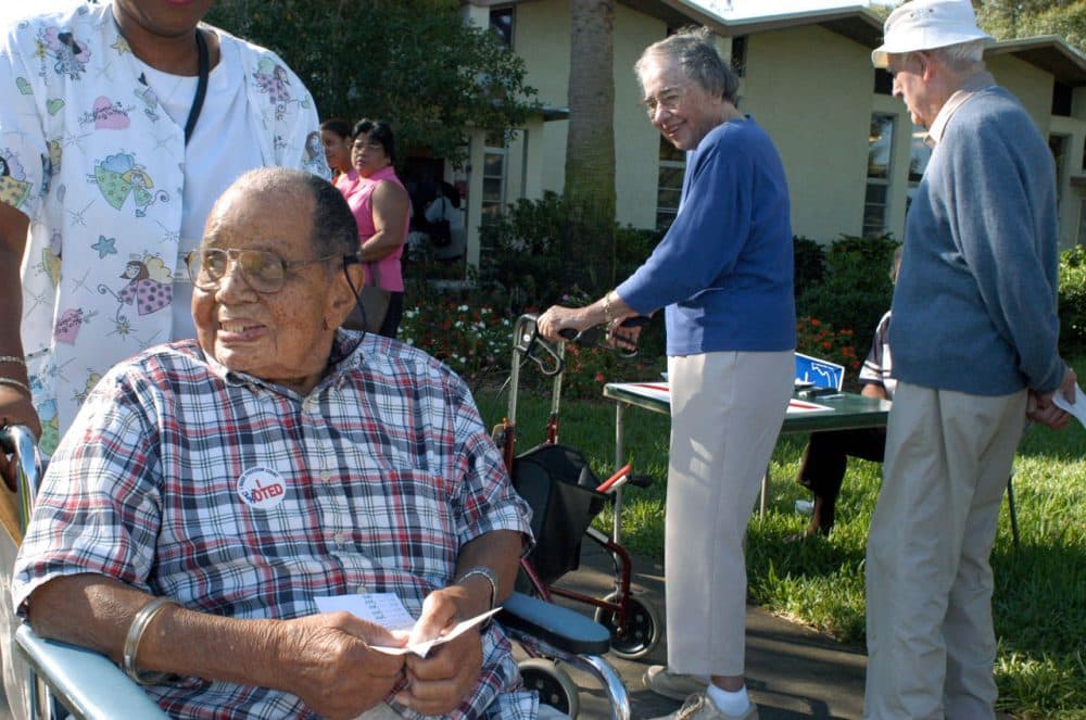 Silas Simmons, 109, leaves a polling place after casting his ballot November 2, 2004 in St. Petersburg, Florida. (Tim Boyles/Getty Images)