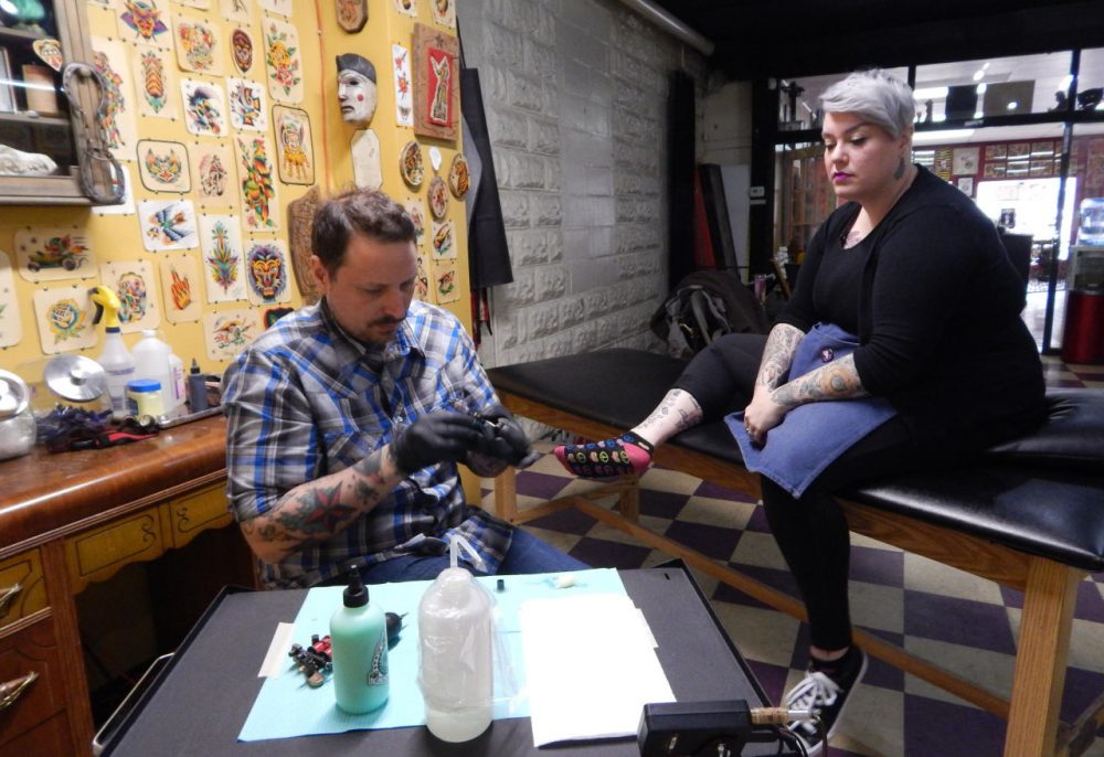 Tony Caporusso gave his wife Carrie Metz-Caporusso the first Flint tattoo of the day.(Mercedes Mejia)