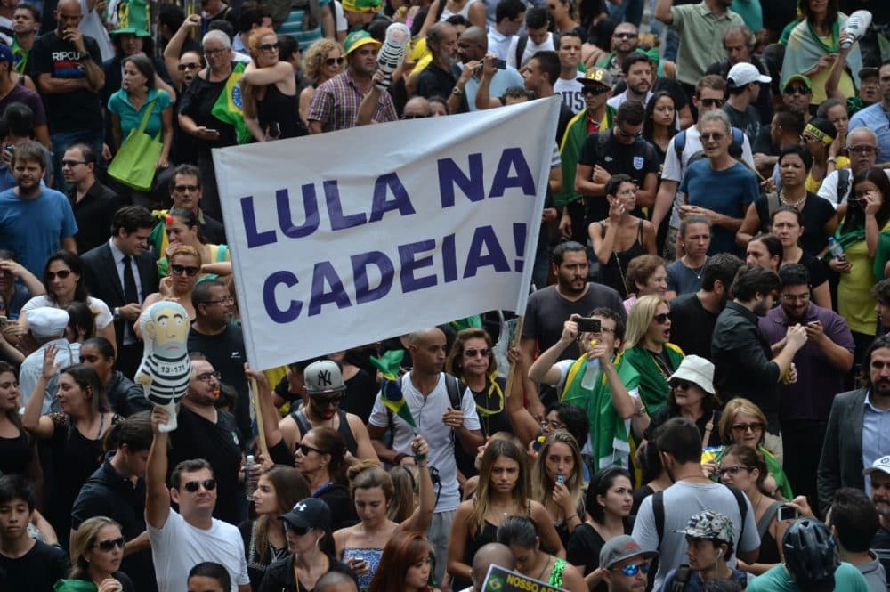 People demonstrate against Brazilian former president Luiz Inacio Lula da Silva in Sao Paulo downtown Brazil on March 17 2016. A federal judge in Brazil suspended President Dilma Rousseff's appointment of her predecessor Luiz Inacio Lula da Silva as her new chief of staff Thursday, amid allegations she gave him the post to protect him from corruption charges.  (Nelson Almeida/AFP/Getty Images)