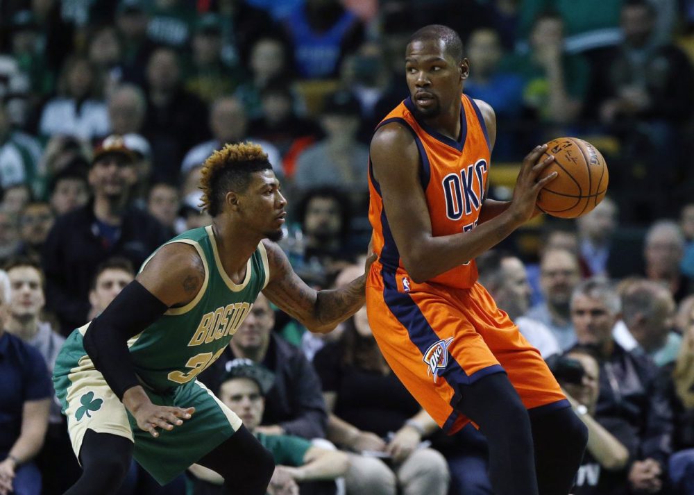 Thunder's Kevin Durant looks to move on Celtics' Marcus Smart during a game at the Garden, Wednesday, March 16, 2016. (Michael Dwyer/AP)