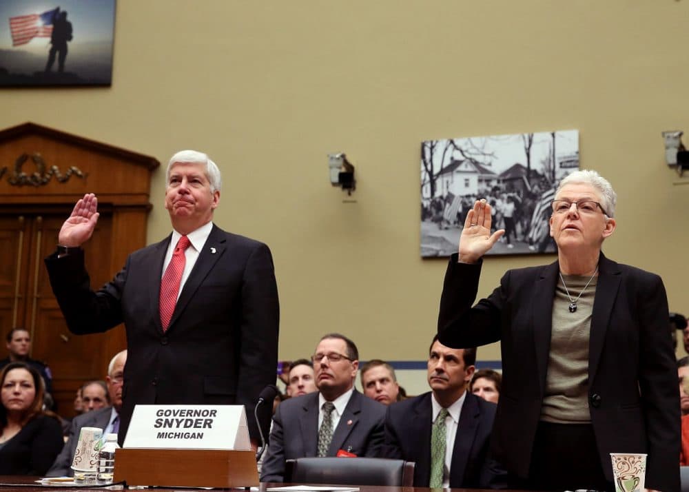 EPA Administrator Gina McCarthy, (R), and Gov. Rick Snyder, (R-MI), are sworn in during a House Oversight and Government Reform Committee hearing, about the Flint, Michigan water crisis, on Capitol Hill March 17, 2016 in Washington, DC. The committee is examining how lead ended up in the public drinking water in Flint, Michigan.  (Mark Wilson/Getty Images)