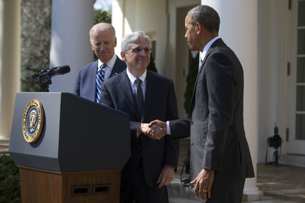 Garland, center, shakes hands with President Barack Obama, right, as Vice President Joe Biden watches during his introduction as Obamas nominee for the Supreme Court in the Rose Garden of the White House. (Evan Vucci/AP)