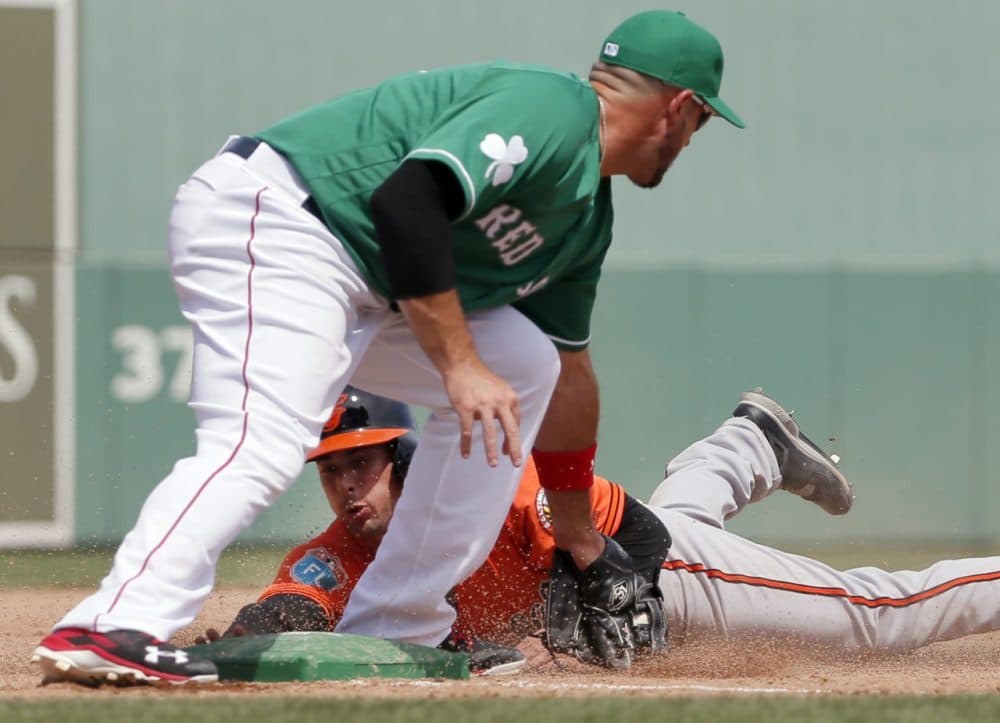 Orioles' Joey Rickard is tagged out trying to steal third by Red Sox' Travis Shaw in a spring training game, Thursday, March 17, 2016, in Fort Myers, Fla. (Tony Gutierrez/AP)