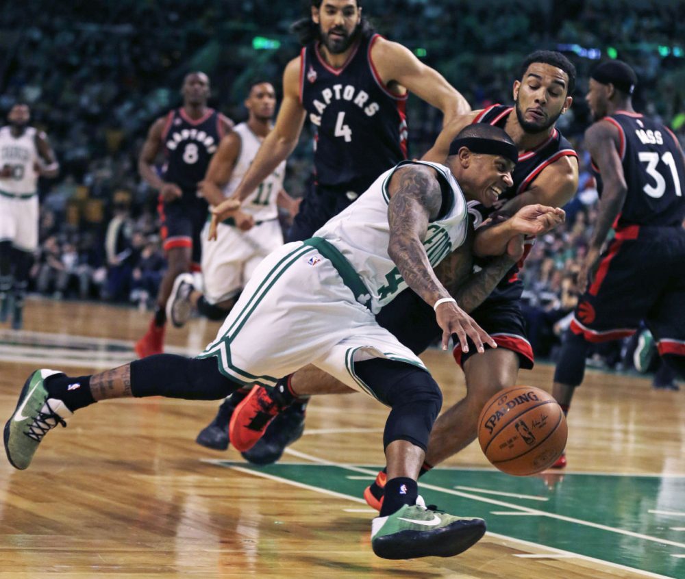 Boston Celtics guard Isaiah Thomas (4) drives to the basket against Toronto Raptors guard Cory Joseph (6) during the first quarter of an NBA basketball game in Boston, Wednesday, March 23, 2016. (Charles Krupa/AP)