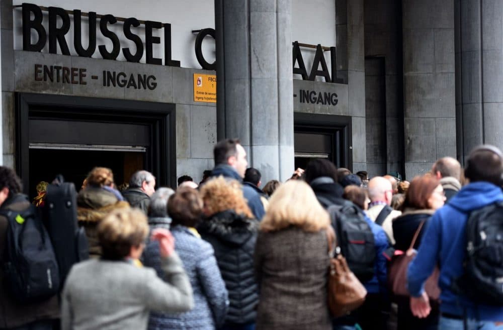 People walk into grand central station on March 24 in Brussels, two days after terrorist attacks in Zaventem airport and Brussels subway Maelbeek that killed 31 and injured 300 people, (Patrik Stollarz/Getty Image)