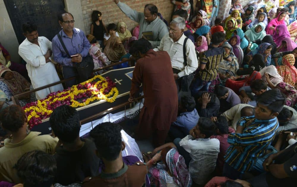 Pakistani Christian mourners attend a funeral ceremony of a blast victim of the March 27 suicide bombing in Lahore on March 28, 2016. Pakistan's army launched raids and arrested suspects after a Taliban suicide bomber targeting Christians over Easter killed 72 people including many children in a park crowded with families. (Arif Ali/AFP/Getty Images)
