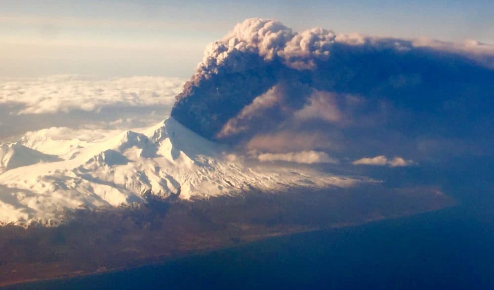 In this Sunday, March 27, 2016, photo, Pavlof Volcano, one of Alaskas most active volcanoes, erupts, sending a plume of volcanic ash into the air. The Alaska Volcano Observatory says activity continued Monday. Pavlof Volcano is 625 miles southwest of Anchorage on the Alaska Peninsula, the finger of land that sticks out from mainland Alaska toward the Aleutian Islands. (Colt Snapp/AP)