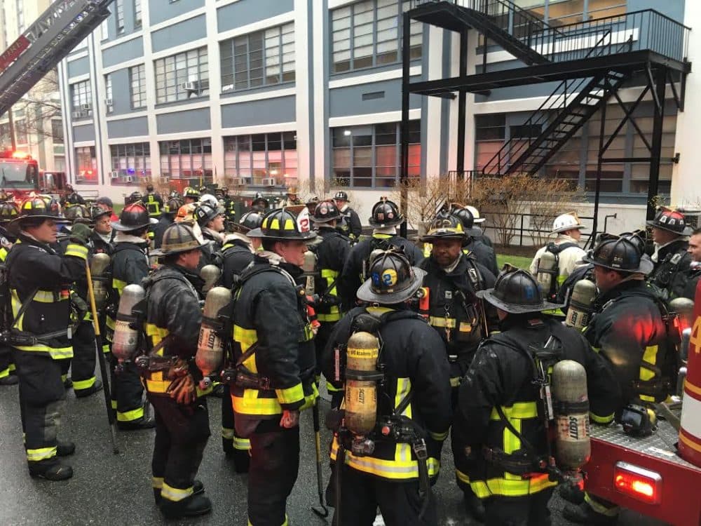 Firefighters on Cummington Street at Boston University Friday (Jesse Costa/WBUR)