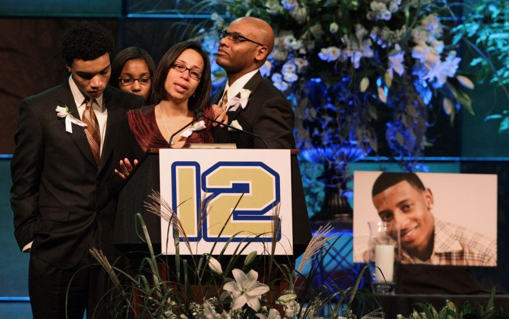 Family members of Danroy &quot;D. J.&quot; Henry talk about him during a memorial service at the Boston Convention and Visitor Center on Oct. 29, 2010. (Stephan Savoia/AP)