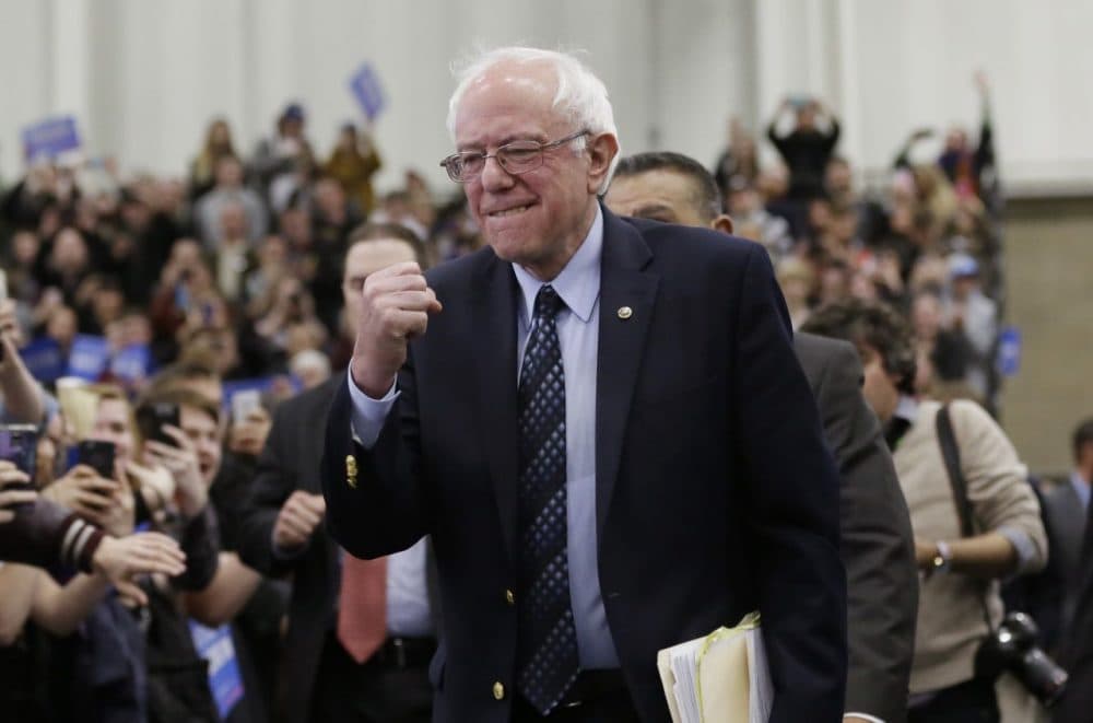 Democratic presidential candidate Sen. Bernie Sanders pumps his fist as he arrives for a rally in Warren, Michigan. (Carlos Osorio/AP)