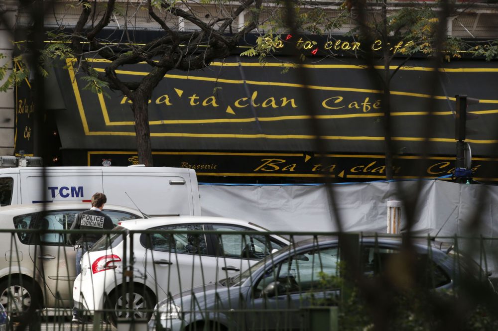 A police officer works outside the Bataclan concert hall the day after more than 100 people were killed in terrorists attacks across Paris, including inside the Bataclan. (Michel Euler/AP)
