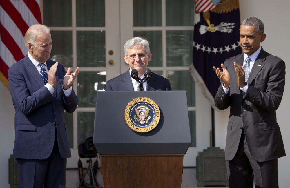 Federal appeals court judge Merrick Garland, receives applauds from President Barack Obama and Vice President Joe Biden as he is introduced as Obama's nominee for the Supreme Court during an announcement in the Rose Garden of the White House, in Washington, Wednesday, March 16, 2016. Garland, 63, is the chief judge for the United States Court of Appeals for the District of Columbia Circuit, a court whose influence over federal policy and national security matters has made it a proving ground for potential Supreme Court justices. (AP Photo/Pablo Martinez Monsivais)