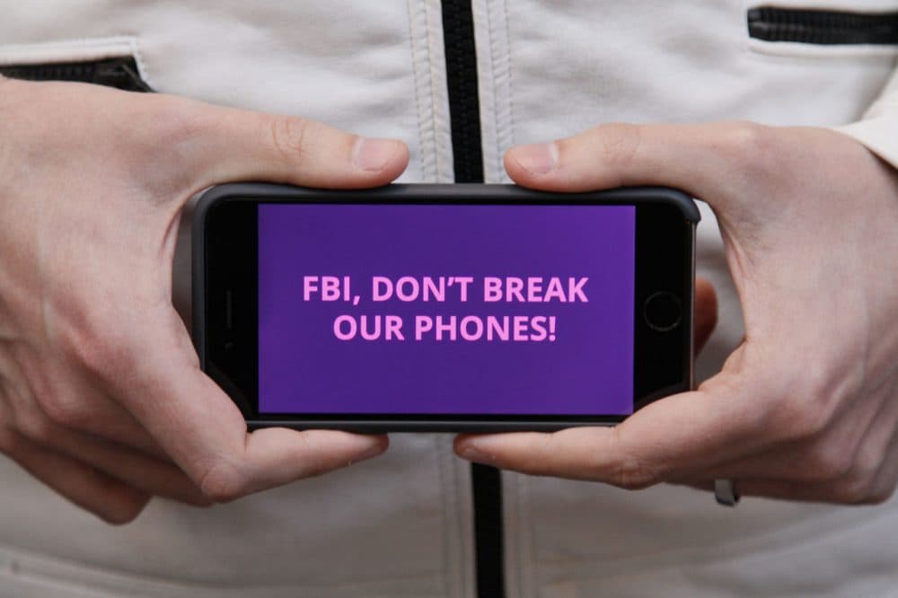Protesters in more than 30 cities have lashed out at the FBI for obtaining a court order that requires Apple to make it easier to unlock an encrypted iPhone. (Eric Risberg/AP)