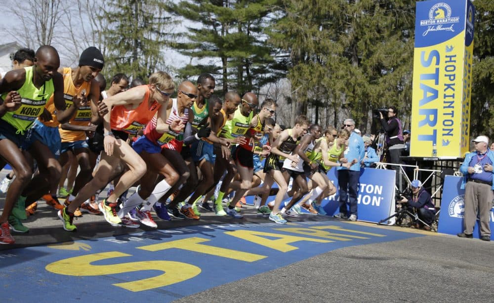 Elite male runners leave the starting line of the 2014 Boston Marathon. (Stephan Savoia/AP)