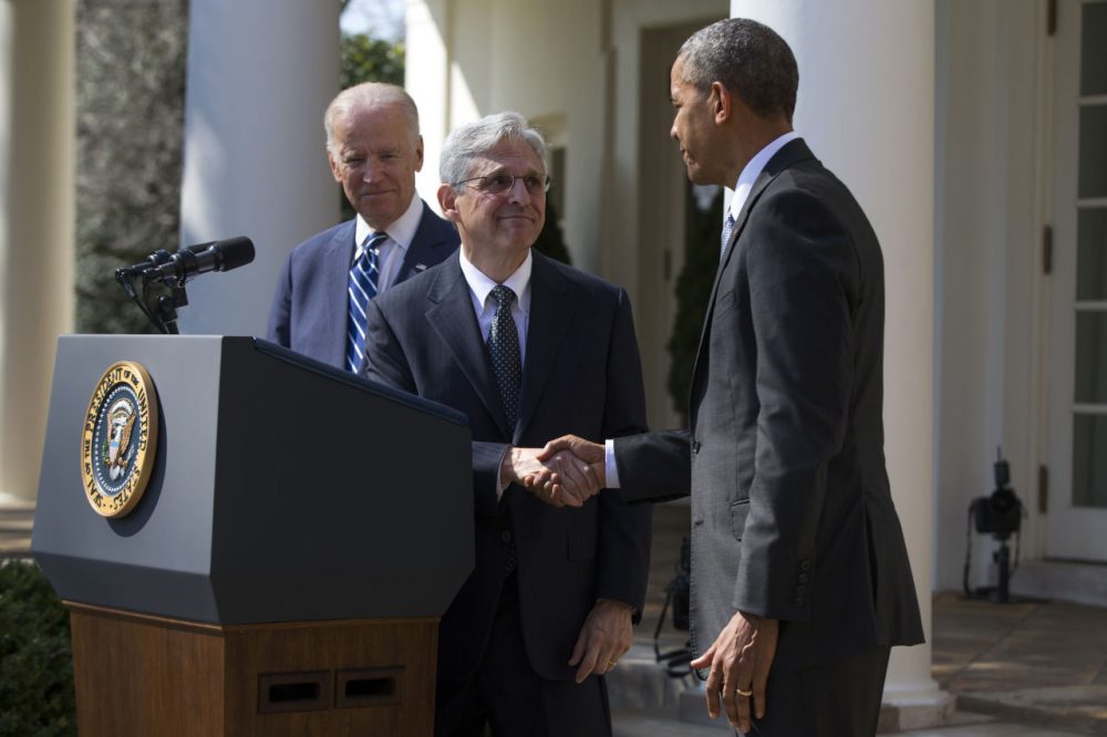 Federal appeals court judge Merrick Garland, center, shakes hands with President Barack Obama, as he is introduced as Obama's nominee for the Supreme Court. (Evan Vucci/AP)