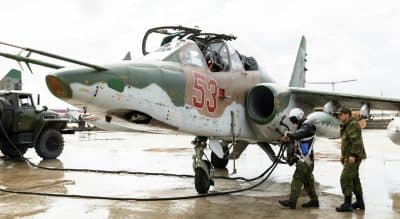 A Russian Su-25 ground attack jet is being refueled for take off at Hemeimeem air base in Syria, Tuesday, March 15, 2016. Russia's defense ministry says another group of its aircraft has left the Russian air base in Syria and is returning home. On Monday, March 14, 2016, Russian President Vladimir Putin ordered Russian military to withdraw most of its fighting forces from Syria, signaling an end to Russia's five-and-a-half month air campaign. (Vadim Grishankin/Russian Defense Ministry Press Service via AP)