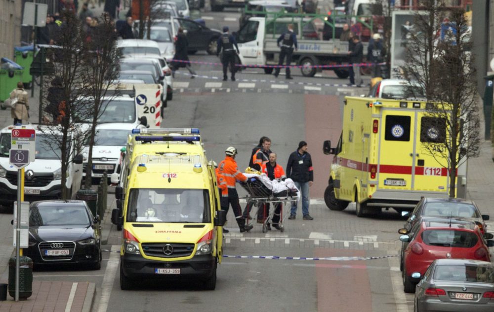 A victim is evacuated on a stretcher by emergency services after a explosion in a main metro station in Brussels on Tuesday. (Virginia Mayo/AP)