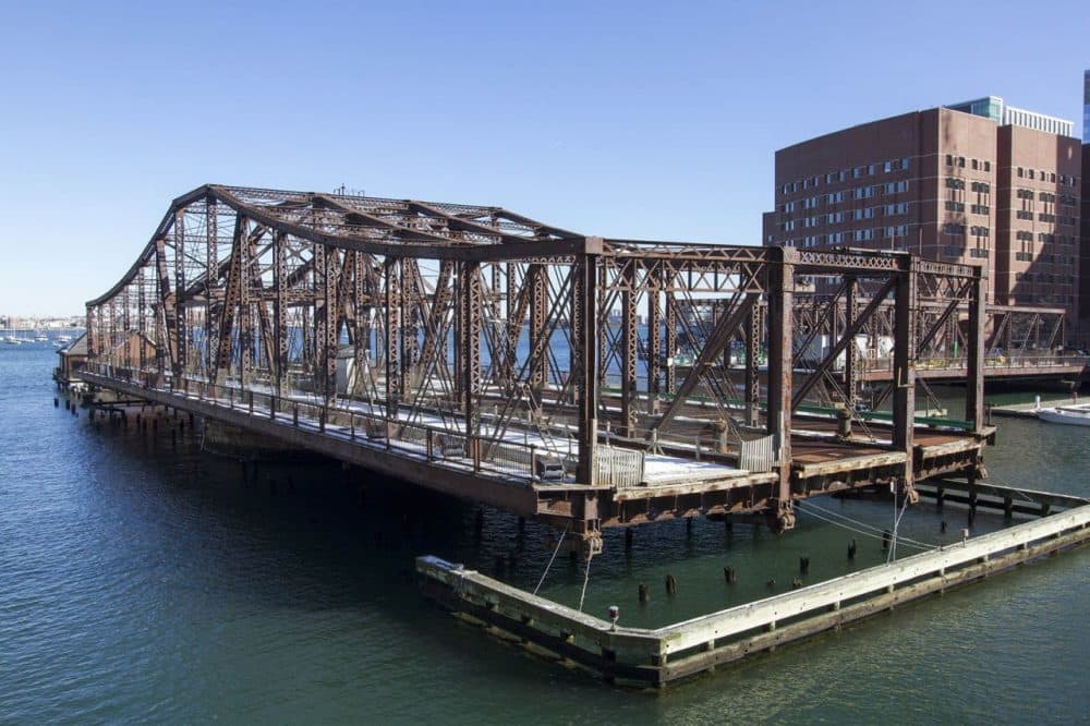 The Northern Avenue Bridge, built in 1908, was closed to cars in 1999 and foot traffic in 2014. Boston plans to spend up to $100 million to replace the now-defunct span. (Joe Difazio for WBUR)