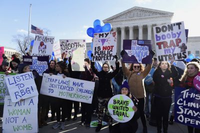 Pro-abortion rights protesters rally outside the Supreme Court in Washington, Wednesday, March 2, 2016. The abortion debate is returning to the Supreme Court in the midst of a raucous presidential campaign and less than three weeks after Justice Antonin Scalias death. (AP Photo/Susan Walsh)
