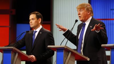 Donald Trump gestures Thursday as Sen. Marco Rubio, R-Fla., listens to Trump's response during a Republican presidential primary debate in Detroit. (AP)