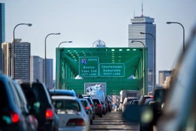 The average car commuter in the region spends 64 hours a year stuck in traffic, a recent report found. (Jesse Costa/WBUR) 