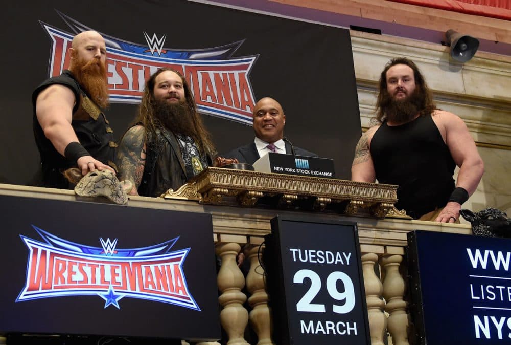 WWE Superstars Erick Rowan, Bray Wyatt and Braun Strowman with NYSE Global head of capital markets Garvis Toler (3rd from left) ring The New York Stock Exchange Opening Bell in honor of WrestleMania 32  at New York Stock Exchange on March 29, 2016 in New York City.  (Jamie McCarthy/Getty Images)