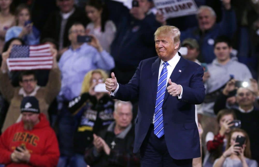 Donald Trump gestures during a campaign stop at the Tsongas Center in Lowell on Jan. 4. (Charles Krupa/AP)