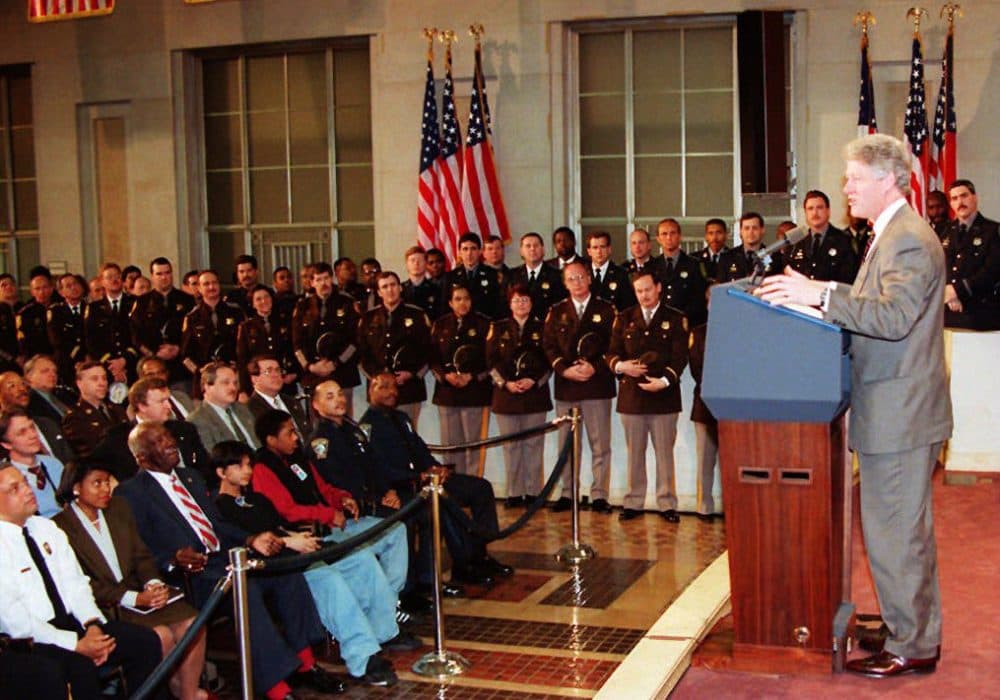 President Bill Clinton speaks about his crime bill to police officers at the Department of Justice, 11 April 1994, in Washington. On the campaign trail for his wife, Hillary, Bill Clinton got into an argument with protestors, who say the Clinton criminal justice reforms led to the mass incarceration of African-Americans. (Joshua Roberts//AFP/Getty Images)