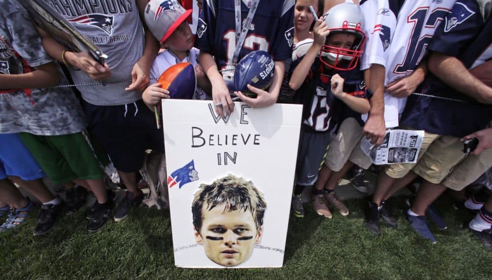 New England Patriots fans stand behind a sign supporting quarterback Tom Brady. (Charles Krupa/AP)