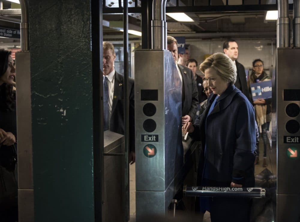 Democratic presidential candidate Hillary Clinton swipes a MetroCard to ride the No. 4 train as she campaigns on April 7, 2016 in the Bronx borough of New York City. The former U.S. secretary of state first spoke outside of Yankee Stadium before riding the subway from the 161st Street station to the 170th Street station.  (Andrew Renneisen/Getty Images)