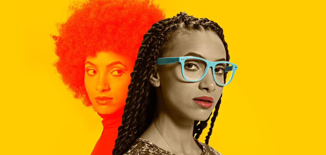 This recent promotional photo of Esperanza Spalding shows her new look -- long braids and pastel framed eyeglasses -- juxtaposed against the style of the Spalding that rose to fame in 2011. (Courtesy Shore Fire Media)