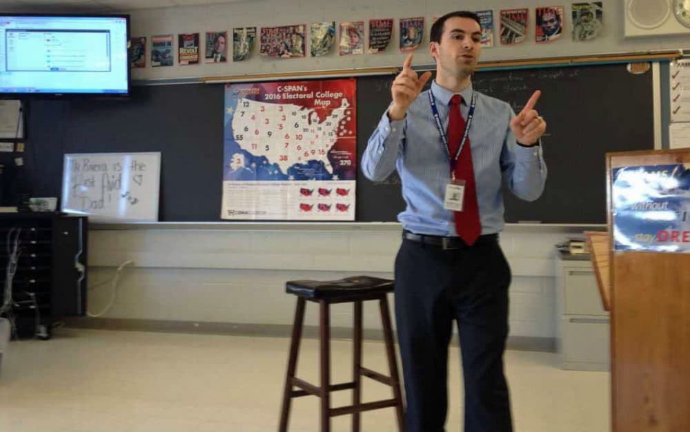Kenny Rivera, government teacher at Brandywine High Schoo, talks with students about the 2016 presidential campaign. (Avi Wolfman-Arent/WHYY)