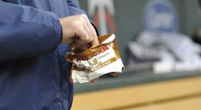 Chewing tobacco, seen here in this 2011 photo, has been a nearly two-century-old habit of many baseball players on the field and in the dugout. Boston's citywide ordinance banning all smokeless tobacco products from its sporting venues went into effect on April 1, 2016. (Jim Mone/AP)