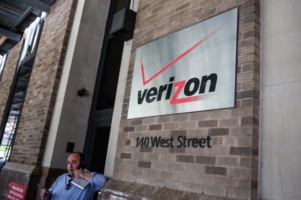 A sign hangs on the Verizon headquarters on May 12, 2015 in New York City. (Andrew Burton/Getty Images)