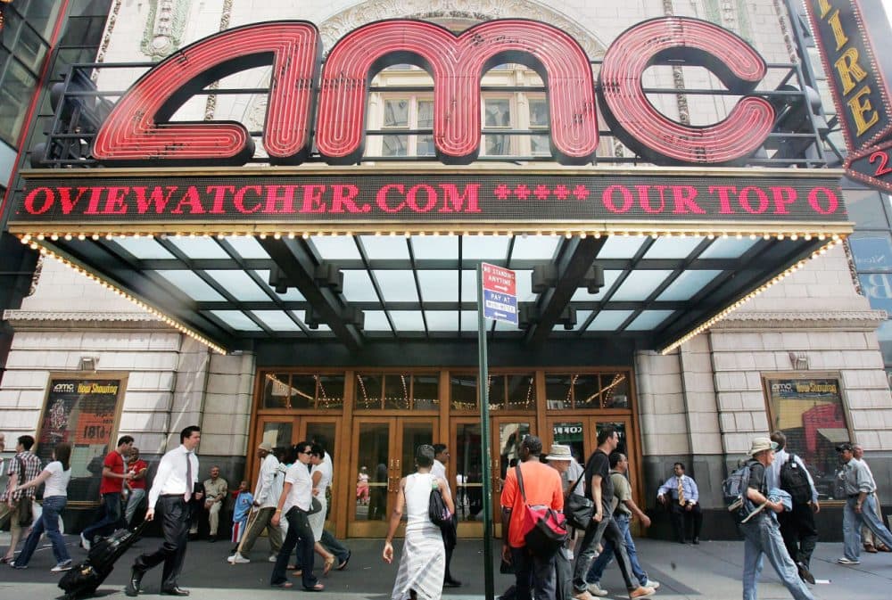 Pedestrians pass an AMC movie theater in Times Square June 21, 2005 in New York City. AMC Entertainment Inc. announced plans to acquire Loews Cineplex Entertainment Corp. to form a combined company called AMC Entertainment Inc. which will have interests in about 450 movie theaters.  (Mario Tama/Getty Images)