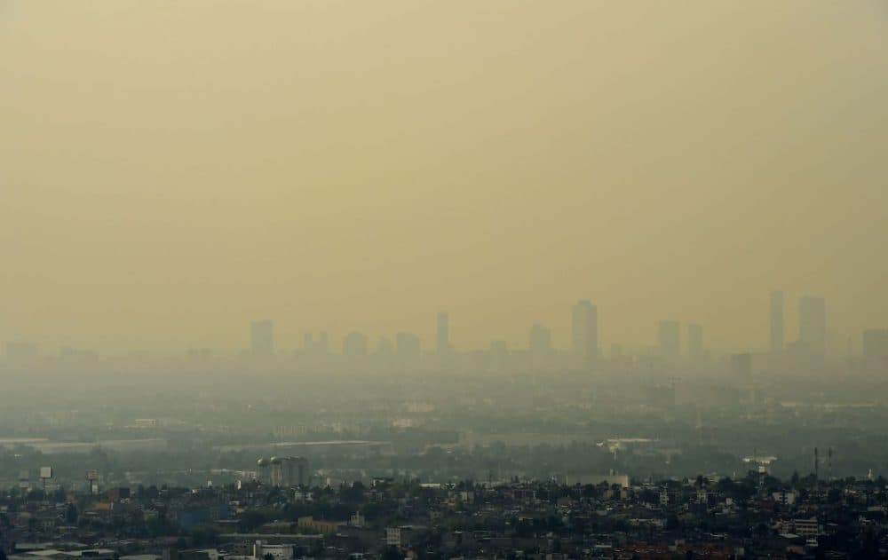 View from Tlanepantla of Mexico City blanketed by smog on March 18, 2016. Mexican officials lifted a four-day air pollution alert in the nation's densely-populated capital after ozone levels dropped, according to them, to acceptable levels. Mexico City authorities issued the first air pollution alert in 14 years due to high ozone levels, restricting traffic, encouraging children to stay indoors and ordering factories to cut emissions. (Ronaldo Schemidt/AFP/Getty Images)