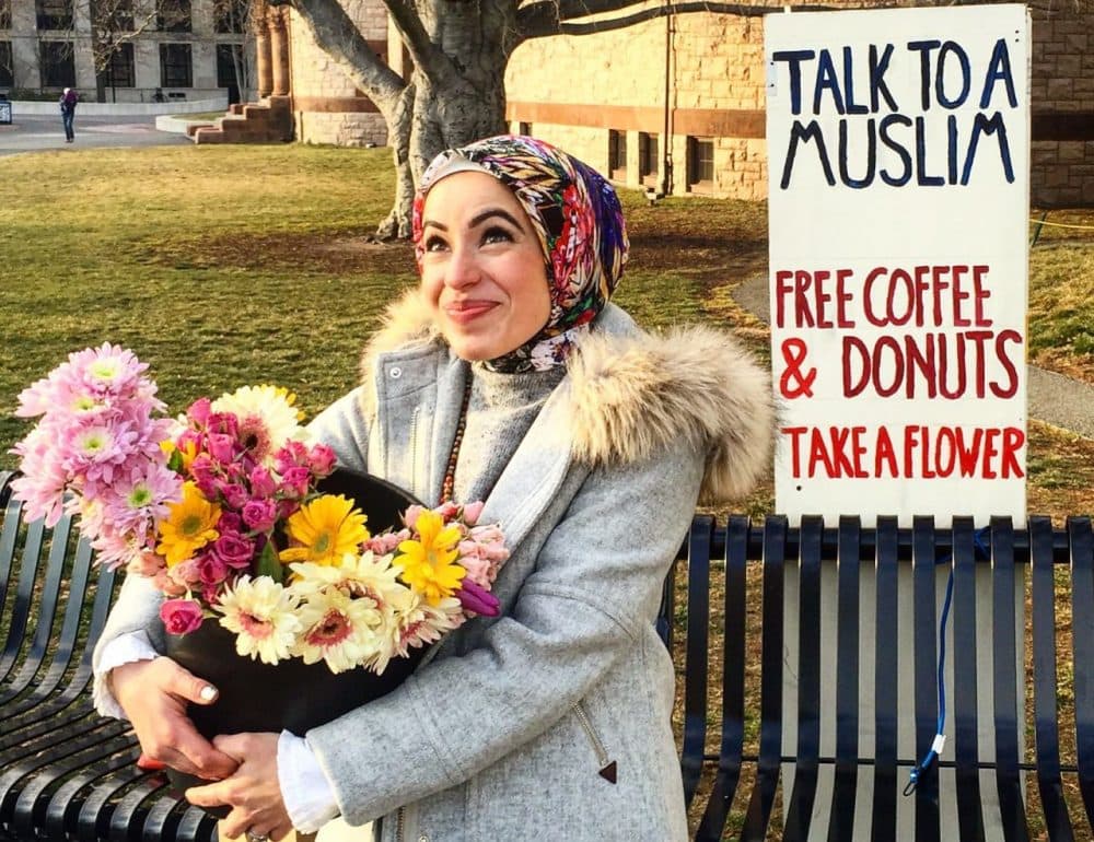 Mona Haydar hands out free coffee, donuts and flowers. (Courtesy Mona Haydar)