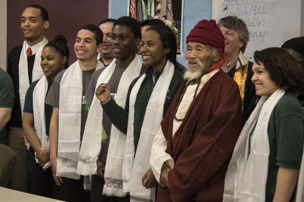 Thinley, an elder from the Nepalese village of Saldang, stands with students from Hartford's Academy of Engineering and Green Technology during his visit to the school Friday.
(JACKSON MITCHELL/WNPR)
