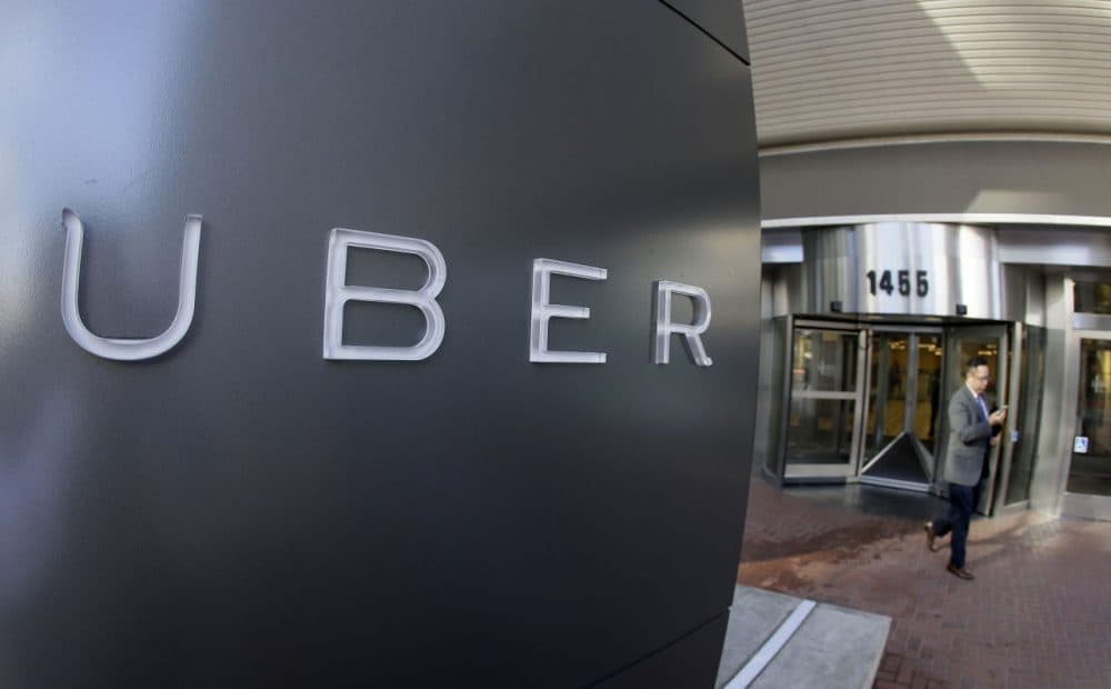 A man leaves the headquarters of Uber in San Francisco, Dec. 16, 2014. (Eric Risberg/AP)