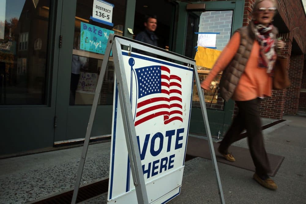 Voters exit a polling station on November 4, 2014 in Westport, Connecticut. (Spencer Platt/Getty Images)