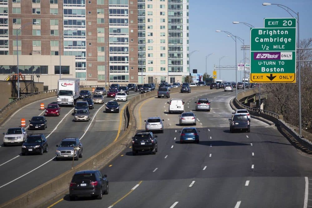Morning traffic on the Mass. Pike, facing west, as it goes over Allston. A proposed project would change the highway's path through the neighborhood. (Jesse Costa/WBUR)