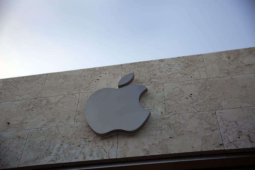 A sign is seen hanging outside of  an Apple computer store on April 26, 2016 in Miami Beach, Florida. Investors reacted negatively to the news that Apple Inc. reported adjusted quarterly earnings of $1.90 a share, below the $2 a share expected by analysts.  (Joe Raedle/Getty Images)