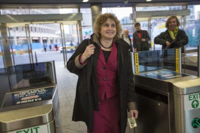 Secretary of Transportation Stephanie Pollack enters the turnstiles at the Government Center MBTA station on the Green Line during her commute to Newton. (Jesse Costa/WBUR)