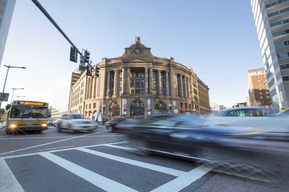 Traffic zooming by Boston's South Station. (Jesse Costa/WBUR)