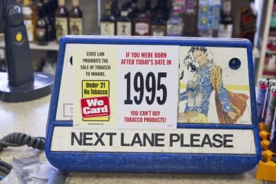 The Massachusetts Senate voted to raise the minimum age to buy tobacco products from 18 to 21. Signs like this one may need to change if the legislation makes it to the governor's desk. (Joe Difazio for WBUR)