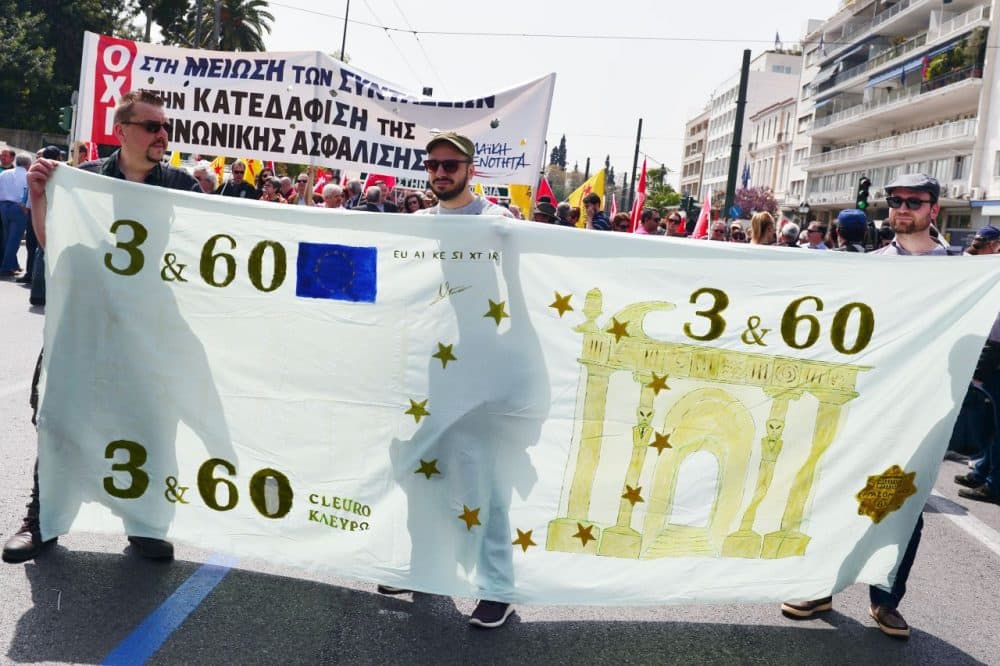 Protesters hold a banner depicting a mock Euro banknote during a protest in Athens marking the 24-hours civil servants' strike on April 7, 2016. 
Greece's largest public sector union ADEDY called for the strike to protest against the government's planned pension reforms.  (Louisa Gouliamaki/AFP/Getty Images)