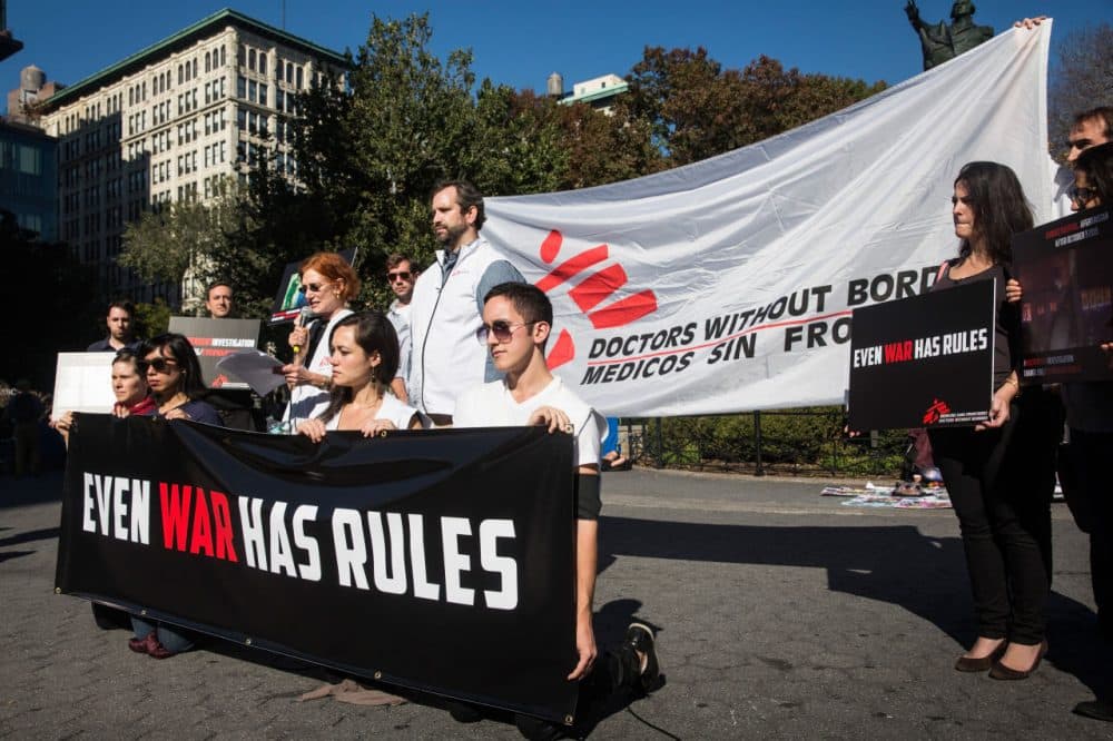 Supporters of Doctors Without Borders/Medecins Sans Frontieres (MSF) gather in Union Square to commemorate the one month anniversary of the bombing of a MSF hospital in Kunduz, Afghanistan on November 3, 2015 in New York City. (Andrew Burton/Getty Images)