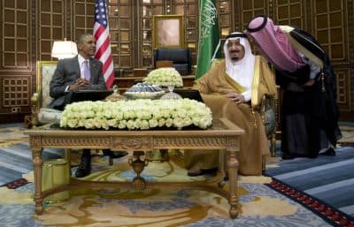 An interpreter talks to Saudi Arabia's King Salman as he meets with President Barack Obama at Erga Palace in Riyadh, Saudi Arabia, Wednesday, April 20, 2016. Obama's first stop in Saudi Arabia was a one-on-one meeting with King Salman before the six-nation GCC summit opens Thursday. He was slated to spend little more than 24 hours in the Saudi capital before heading on to visits to London and Hannover, Germany.  (AP Photo/Carolyn Kaster)