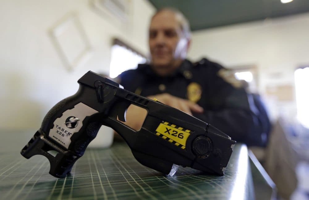 The Massachusetts State Police is spending $1 million to buy 895 electronic control weapons (ECWs), known by the brand name of Taser. (Michael Conroy/AP/File)